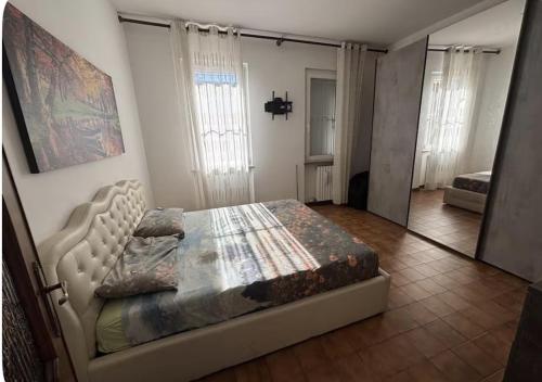 a bedroom with a bed in a room at Casa Rossa in San Leonardo
