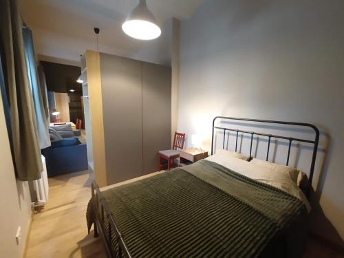 a bedroom with a bed in a room at Robezu apartments 14 in Riga