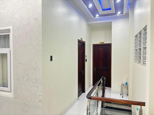 a hallway with a door and a stair case at Beachside home 2 in Phú Quốc