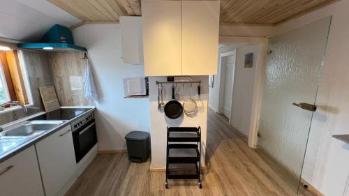 a small kitchen with a sink and a dishwasher at D1 - Klein aber fein in Wernigerode