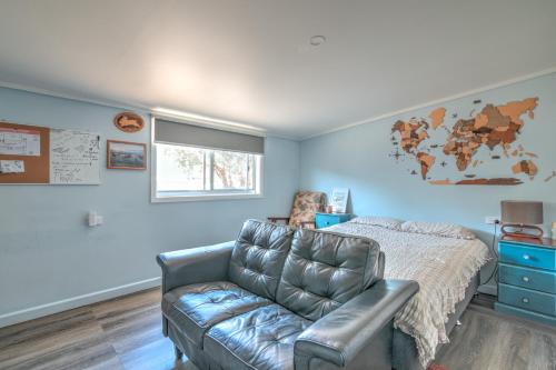 a living room with a couch and a bed at Zamenhof River Cabin - Peaceful Farm Escape - Pets Welcome in Yass
