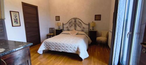 a bedroom with a large bed in a room at B&B Della Via Francigena in Agrigento