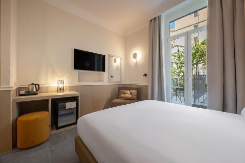 a hotel room with a bed and a television at Hotel Astoria Garden in Rome
