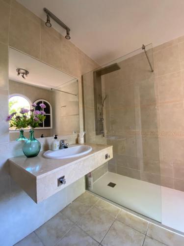 a bathroom with a sink and a shower at El Olivar Beach Golf in Caleta De Fuste