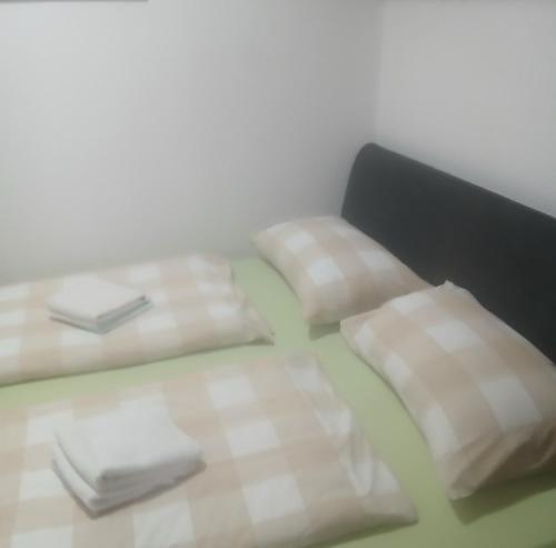 a room with three tables with white napkins at Jahorina Ski View Apartman in Jahorina