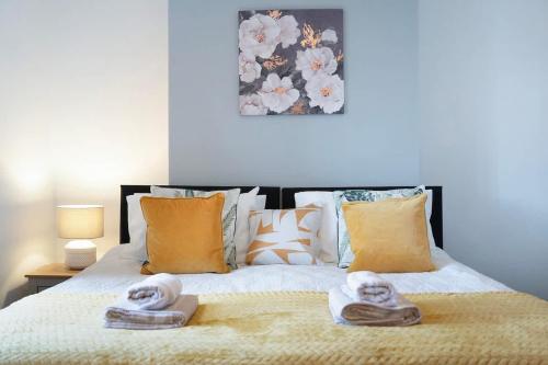 a bedroom with a bed with towels on it at Family-Friendly 2BR Close to Durham City in Ushaw Moor