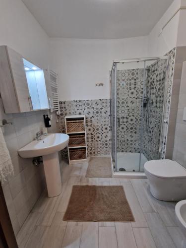 a bathroom with a shower and a sink and a toilet at Dimore Rosantò 2 in Palombaro