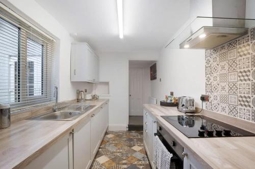 a kitchen with a sink and a counter at NEW! 3BR in Haughton Road in Darlington