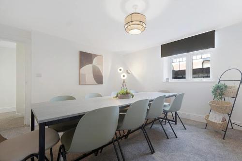 a dining room with a table and chairs at Spacious! 6BR in Beach Road in South Shields