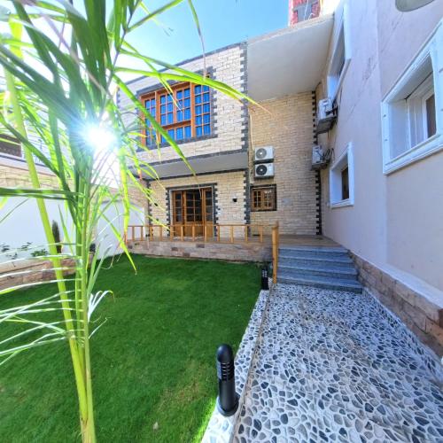 a view of the back yard of a house at Villa golden life apartments, new property with pool access in Luxor