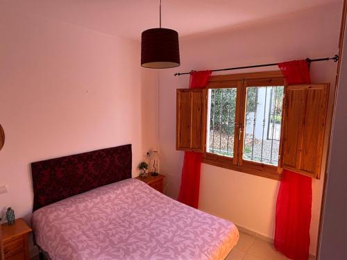 a bedroom with a bed and a window at Villa Canario in Arboleas