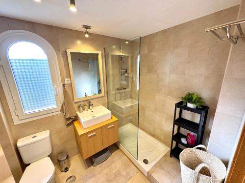a bathroom with a toilet and a sink and a shower at Casa Sofinata with Pool View & Golf in Sucina