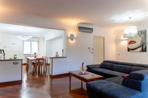 a living room with a couch and a table at La Mia Reggia B&B in San Nicola La Strada