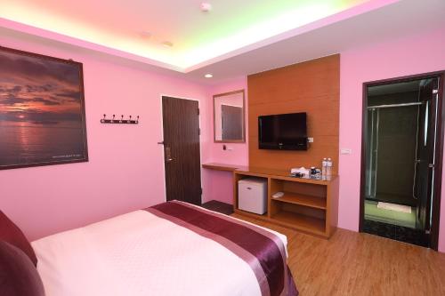 Ein Bett oder Betten in einem Zimmer der Unterkunft Hang Hai B&B