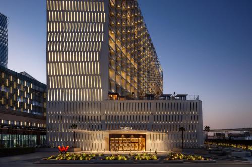 a tall building in front of a large building at W Riyadh - KAFD in Riyadh