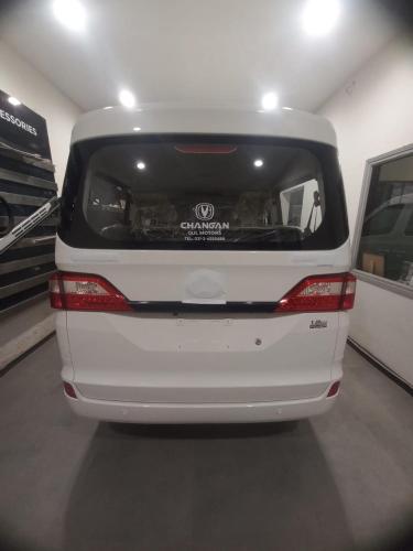 a white van is parked in a garage at Guest Pick-Up & Drop-Off Service in Karachi