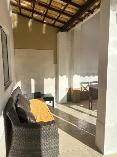 a living room with a couch and a table at CASA ESTRELA e SOL in Barra de Jacuípe