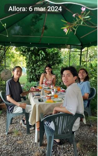 a group of people sitting around a table at B&B delle Arti in Crema
