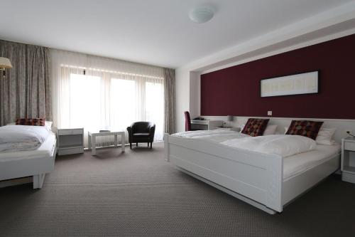 Кровать или кровати в номере Hotel Kramer