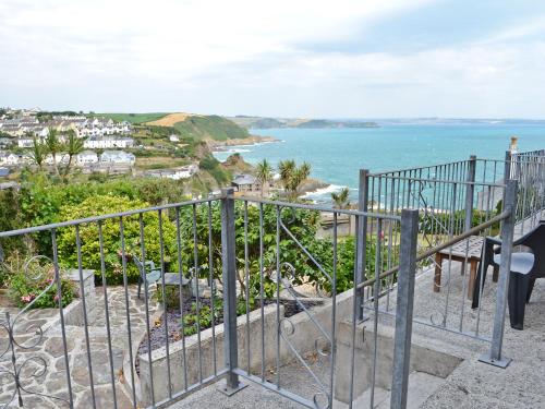 a balcony with a view of the ocean at Morvoren - Ukc3539 in Mevagissey