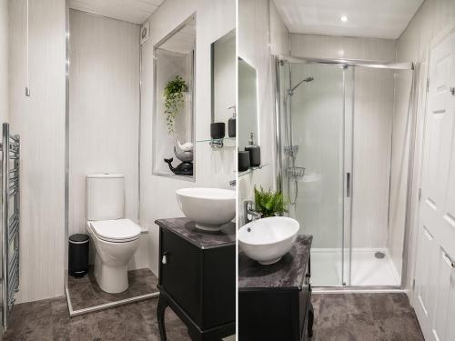 a bathroom with a sink and a toilet and a shower at Saphire Apartments Spacious 1 Bed Apartment Sleeps 6 with Free Parking and Garden in Giffnock