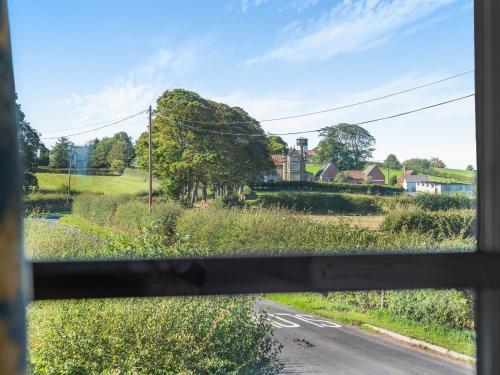 a view of a road from a bus window at Black Bull Cottage in Ugthorpe