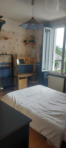 a bedroom with a large bed in a room at Maison de ville in Rouen