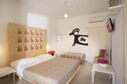 a bedroom with two beds in a room at TerreAmare Agriturismo in Porto Cesareo