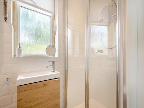 a bathroom with a sink and a shower at The Mill Lodge in Malmesbury