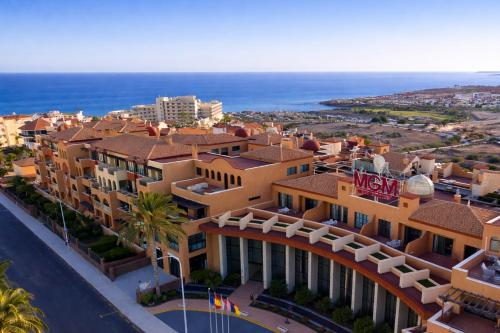 an aerial view of a resort with the ocean at Grand Muthu Golf Plaza Hotel & Spa in San Miguel de Abona