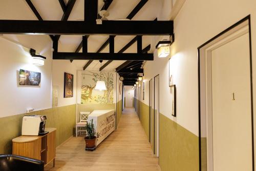 a corridor of an office with a long hallway at Motel Remo in Lovrin
