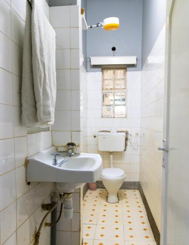 a bathroom with a sink and a toilet at Inuka Guest house in Nairobi
