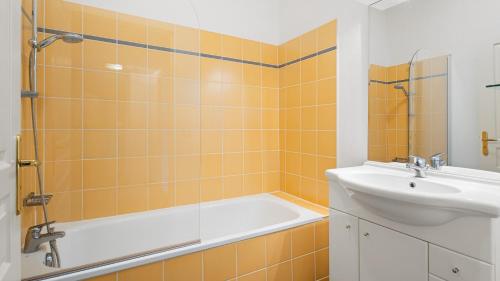 a bathroom with a bath tub and a sink at Virginia N101 ST2 in Grasse