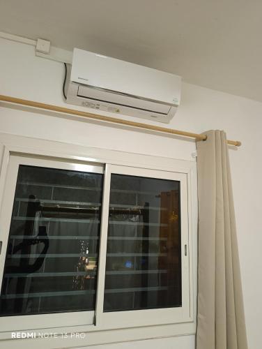a room with a window and a ceiling at NM-Housing in Saint-Denis