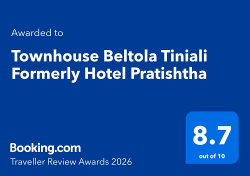 a blue sign that says townhouse belidaiki terminal formerly at Townhouse Beltola Tiniali Formerly Hotel Pratishtha in Guwahati