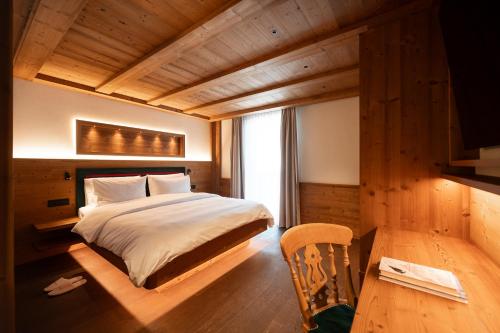 Llit o llits en una habitació de Hotel Fil Da Mont
