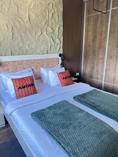 two beds with pillows sitting next to each other at Apartman Viktorija in Žabljak