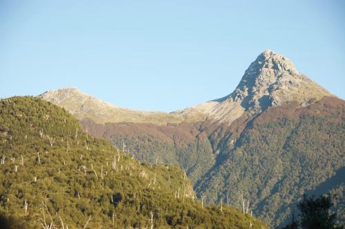 a mountain in the middle of a valley at Casa Campo Carretera Austral in Puerto Cisnes