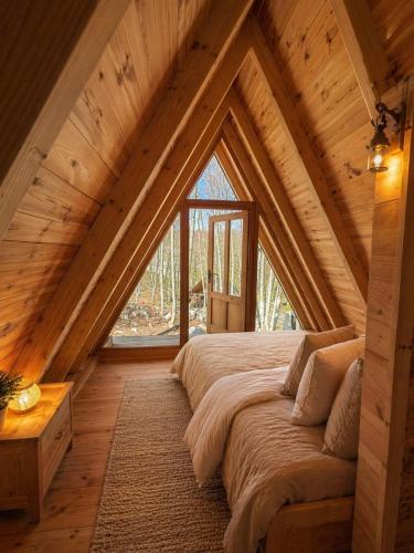 a bedroom with a large bed in a attic at Gorska Dolina in Ivanova Korita