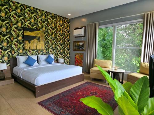 a bedroom with a bed and a large window at Amazing Villa Best View in Boracay