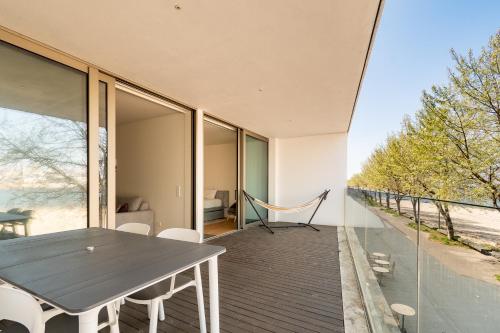 a house with a table and chairs on a balcony at Douro Porto View in Vila Nova de Gaia