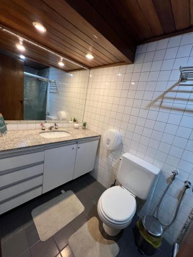 a bathroom with a toilet and a sink at Flat 308 - Vista Mar in Salvador