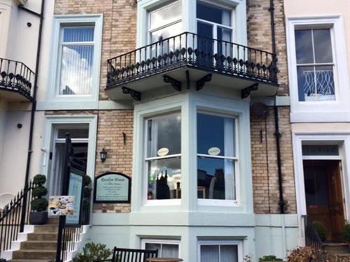 a building with a balcony on top of it at Rosslyn House in Whitby