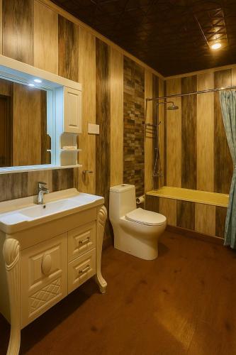 a bathroom with a sink and a toilet and a shower at Imperial Group of Houseboats in Srinagar