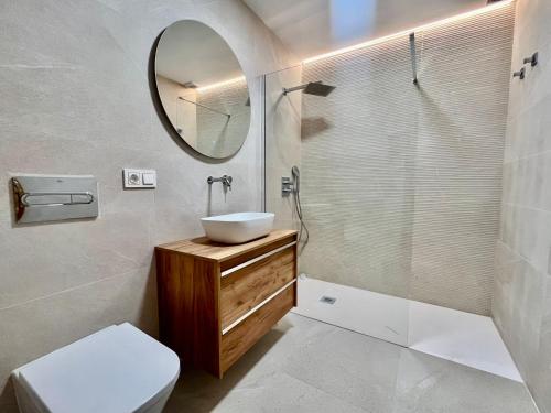 a bathroom with a sink and a mirror at Villa Maria by Albir Proper Properties in Albir