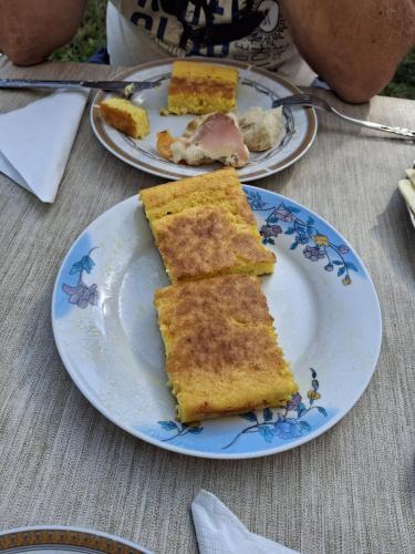 a plate with three slices of cake on a table at Pine corner Mojkovac in Mojkovac