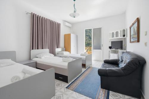 a living room with a couch and a table at Villa Deart Berat in Berat