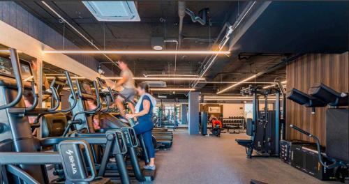 two people standing in a gym with machines at Albaluz in San José del Cabo