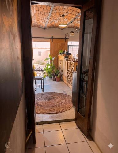 an open door leading to a kitchen with a rug at Akoma San Pancho in San Francisco