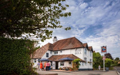 people standing outside of the blue ball inn at The Blue Bell at Cocking in Midhurst